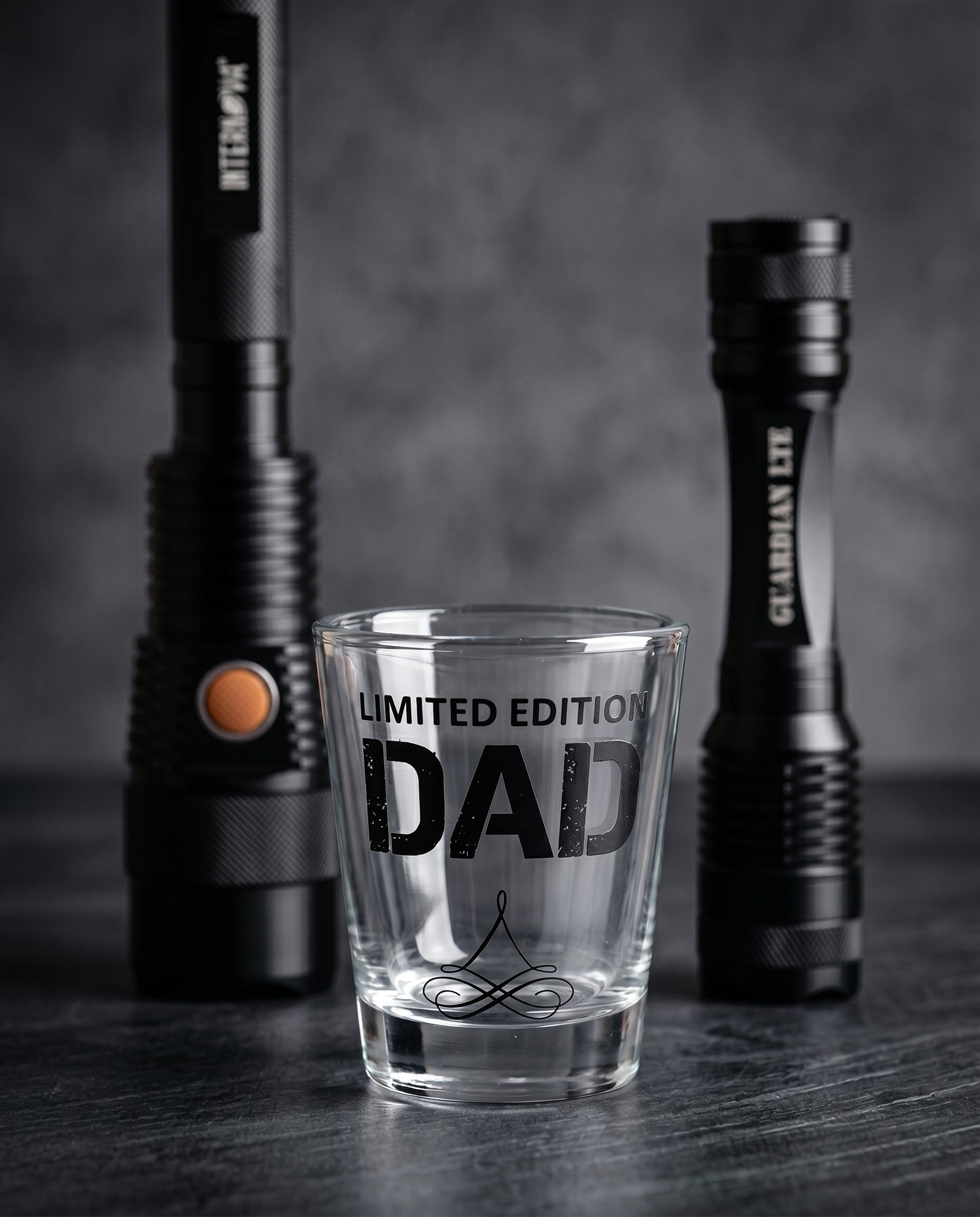 Limited Edition Dad shot glass with Sentinel and Guardian flashlights