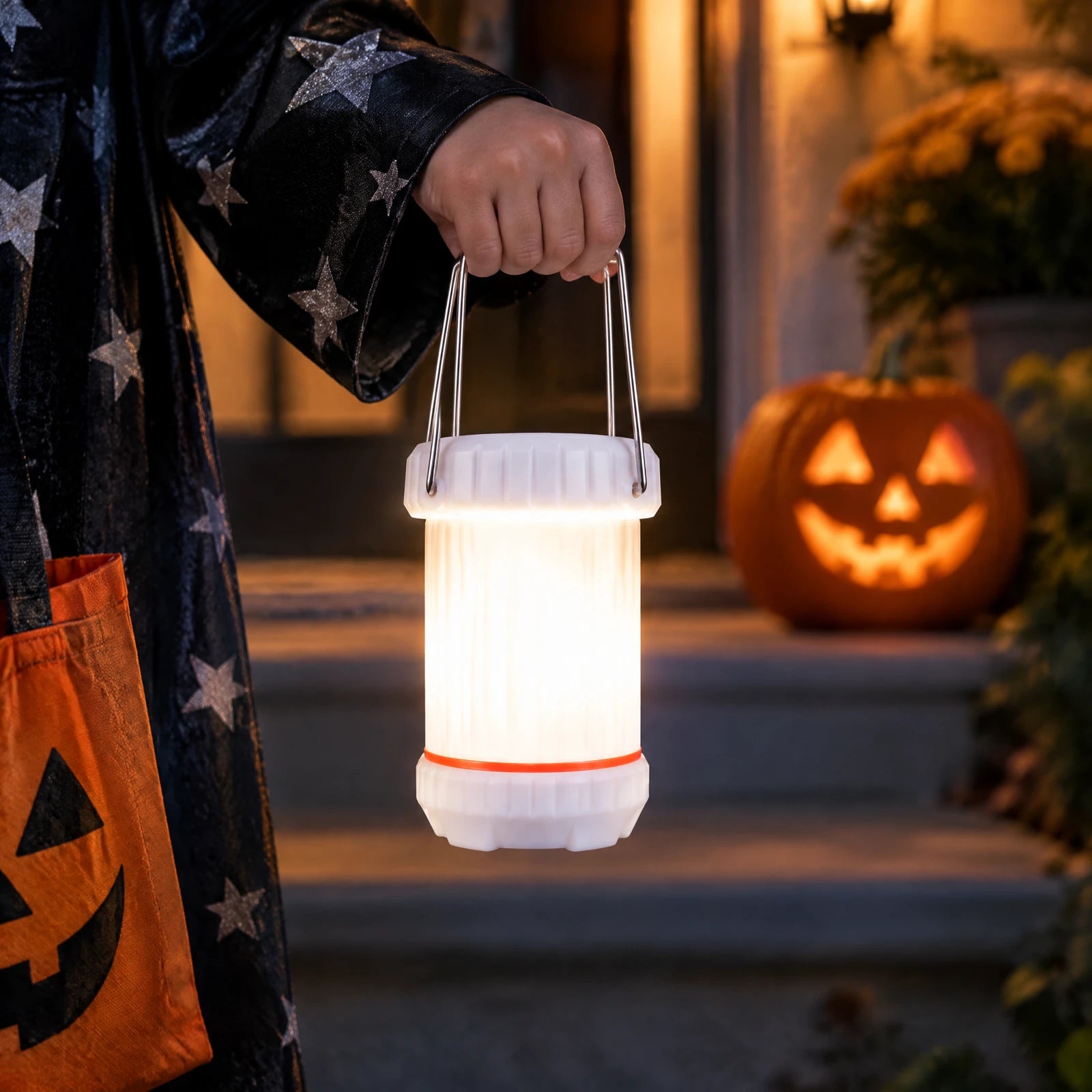 The lantern body glowing softly white in a child’s hand.